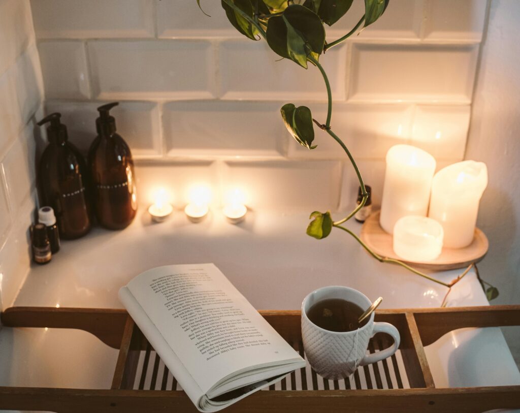 bath with candles and a book