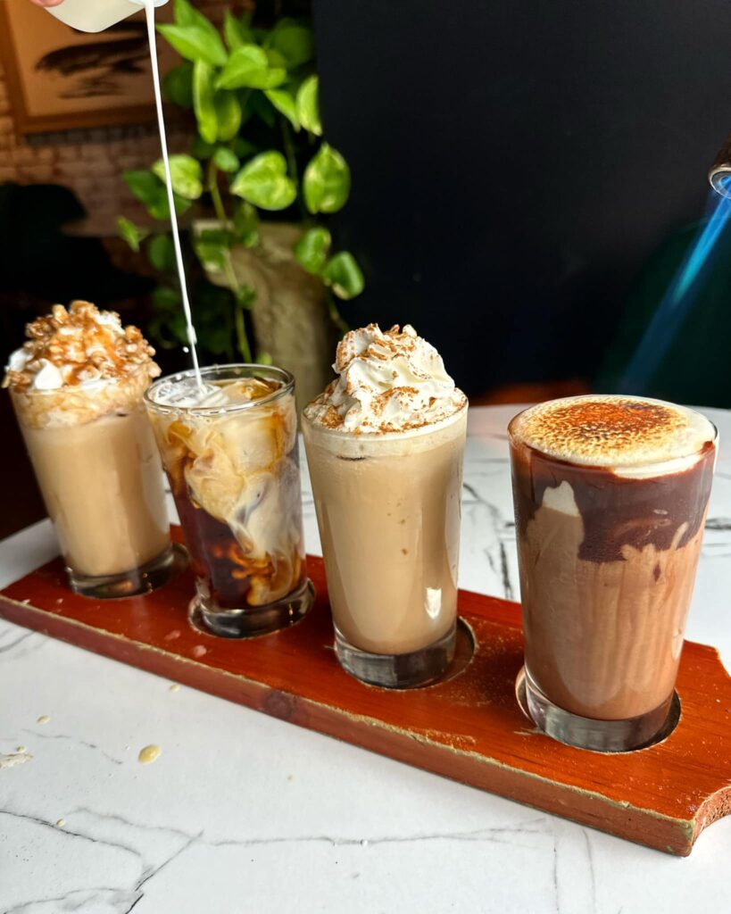 4 different types of iced coffee on a table