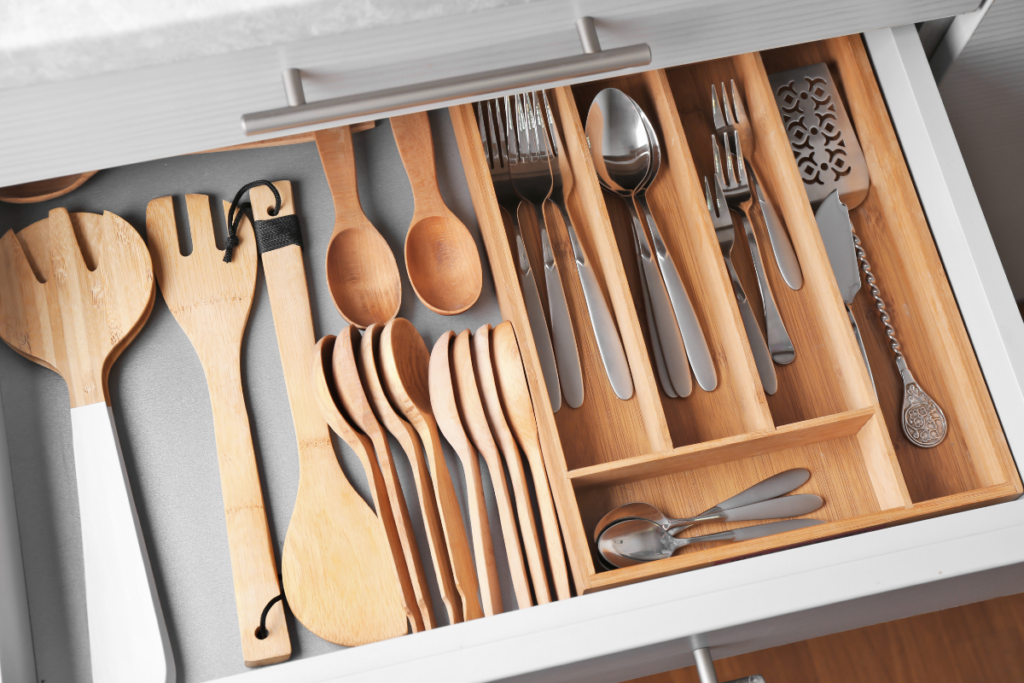 kitchen drawer organizer with silverware in each organized piece