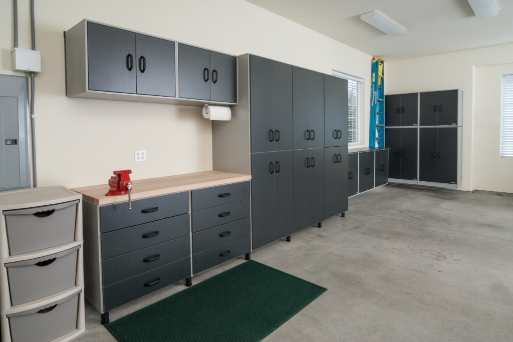 garage organization system with black cabinets and grey bins